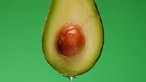 Avocado Half Isolated on Green Background Chroma Key Fresh Sliced Avocado Closeup