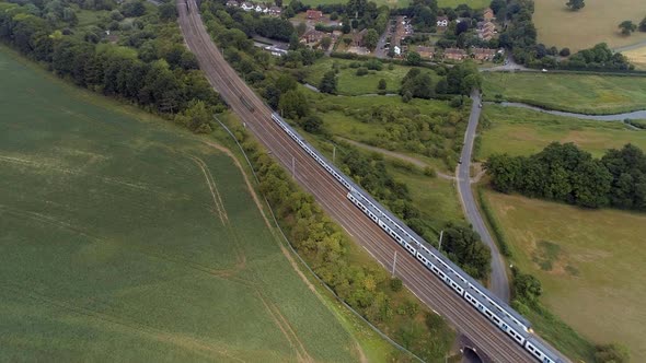 Two Commuter Trains Passing in the Country