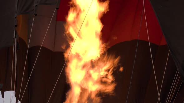 Large Burning Flame of Orange Colour Appears Under Balloon
