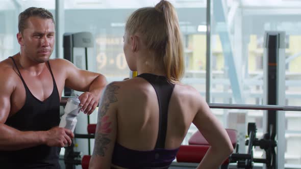 Man and Woman Chatting after Fitness Workout