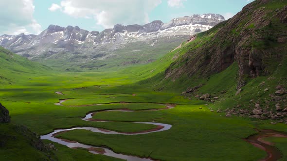 Curved river in mountainous valley