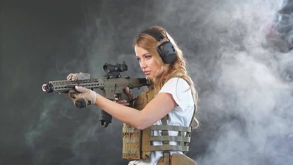 Woman Soldier Sniper in Disguise with a Sniper Rifle, Slow Motion