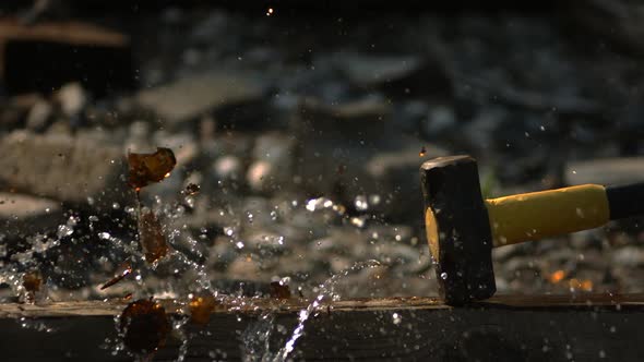 Glass bottle smashed in ultra slow motion 