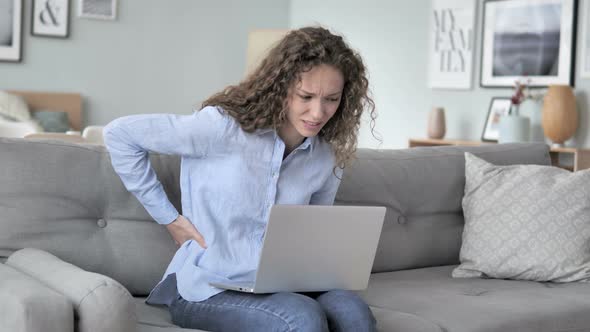 Spinal Back Pain while Curly Hair Woman Working in Creative Office