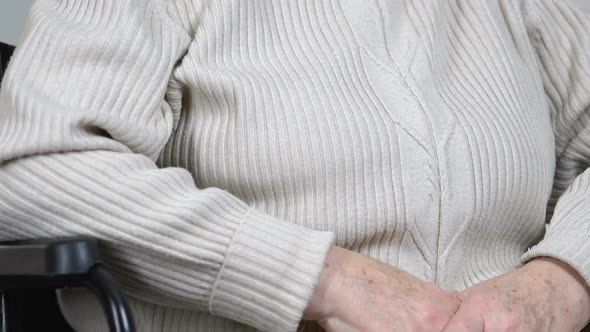 Disabled Elderly Lady Crying Wiping Tears and Looking to Camera, Social Problems