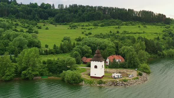 Aerial view of the church on the Liptovska Mara reservoir in Slovakia