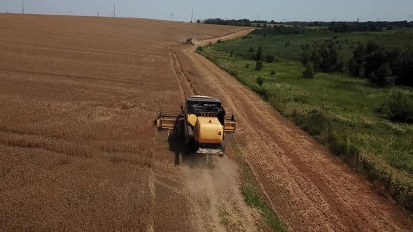 Aerial View of Combine Harvesters Agricultural Machinery. The Machine for Harvesting Grain Crops