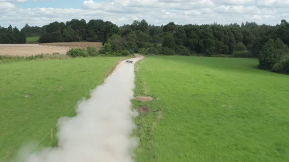 racing car driving on gravel road