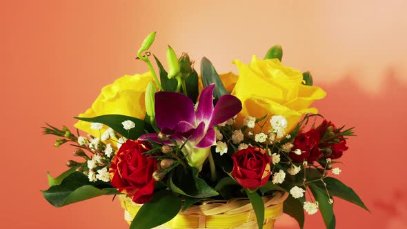 Basket of Flowers on a Pink Background