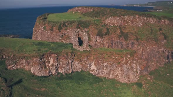 Dunseverick Castle ruins on the Antrim Coast, Northern Ireland. Aerial drone view