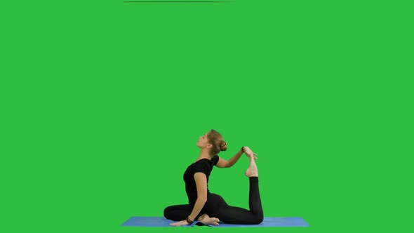 Young Beautiful Yoga Posing On, Stretching, Practicing Yoga on a Green Screen, Chroma Key