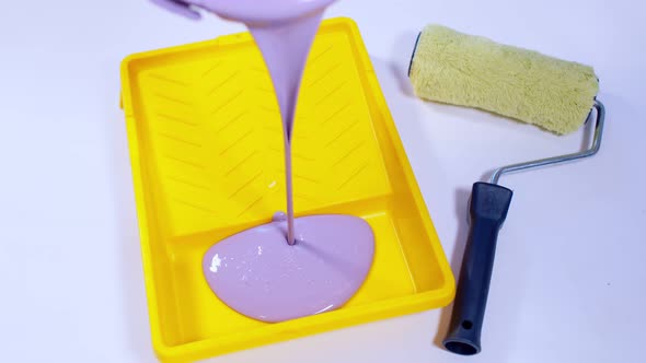 Close Up of Purple Paint Pouring in Plastic Tray