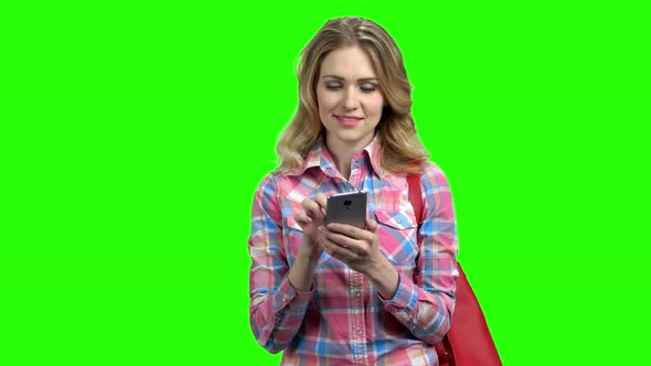 Woman Using Cell Phone on Green Screen