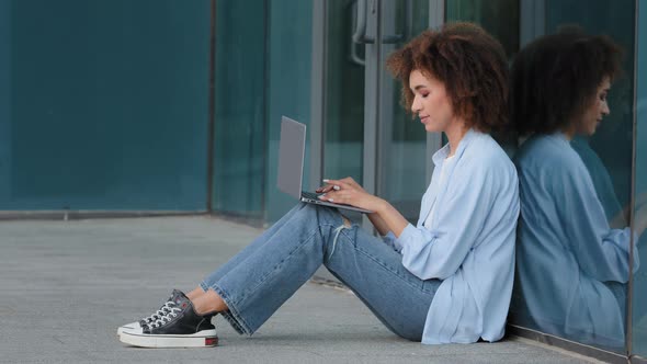 Focused Young African American Business Woman Student Girl Female Freelancer User Sitting on Floor