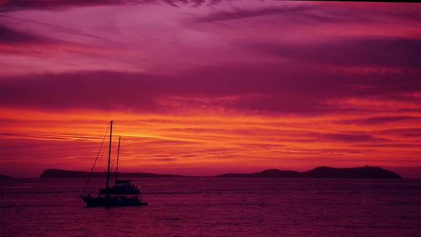 Purple Afterglow after Sunset with Sailing Ships and Yachts and Island Mountains 4k