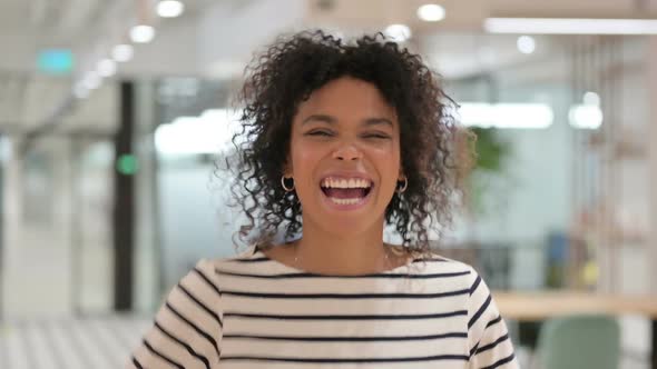 Excited African Woman Celebrating Success