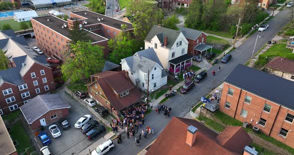 Fraternity sorority Greek life at college party. Students partying, drinking at frat house. Exterior