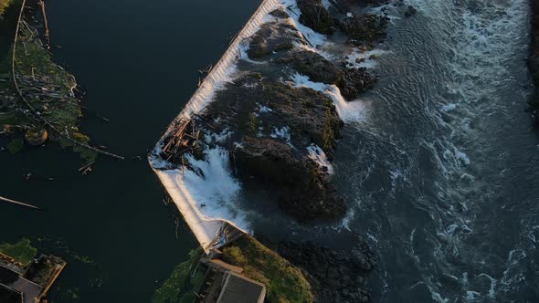 Old Dam and River Flowing Down