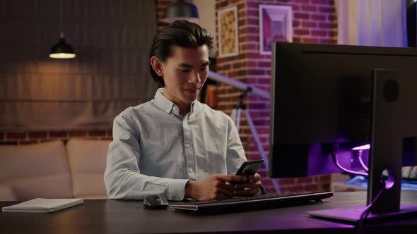 Portrait of Asian Office Worker Typing Paperwork Information