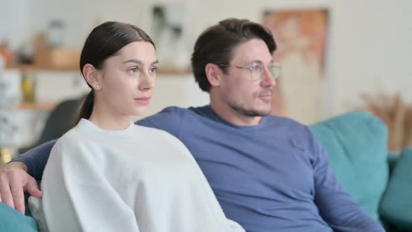 Portrait of Hispanic Couple Looking at Camera and Smiling