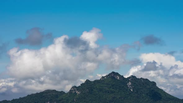 Clouds Cross Over Green Mountains Landscape.