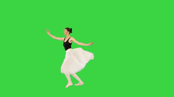 Young Ballerina is Performing Jete on a Green Screen Chroma Key