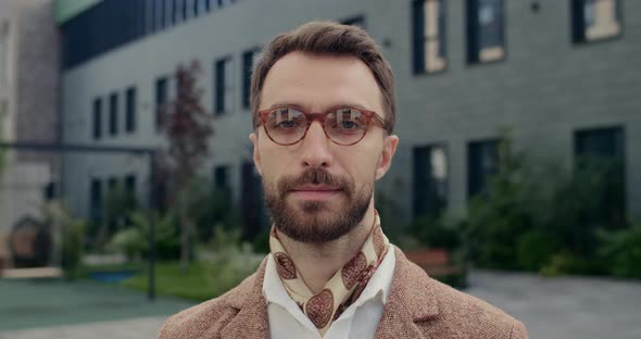 Portrait of Handsome Man in Glasses with Beard Looking To Camera