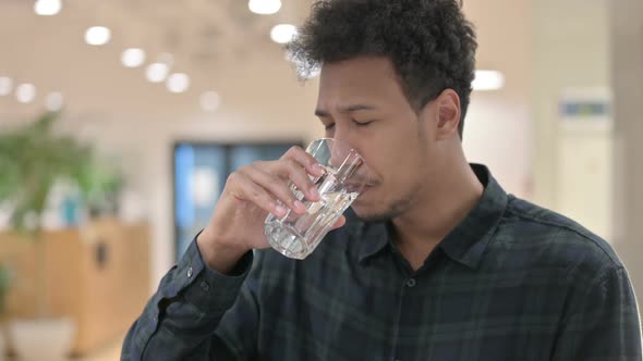 African American Man Having Toothache While Drinking Water