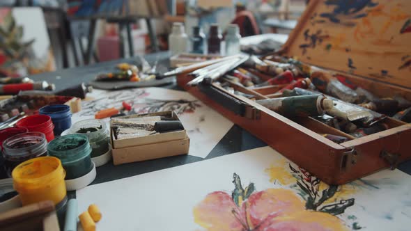 Painting Supplies in Wooden Case on Table in Art Studio