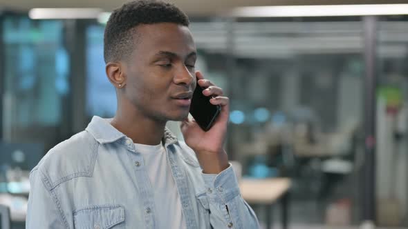 Portrait of African Man Talking on Smartphone