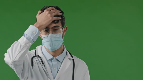 Portrait of Upset Hispanic Young Frustrated Man Therapist Indian Guy Put Hands on Forehead Tired