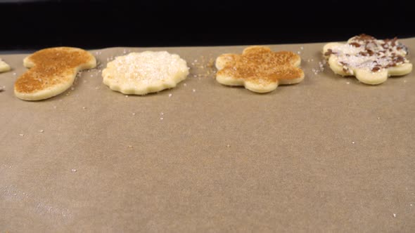 The process of making cookies from shortbread dough.