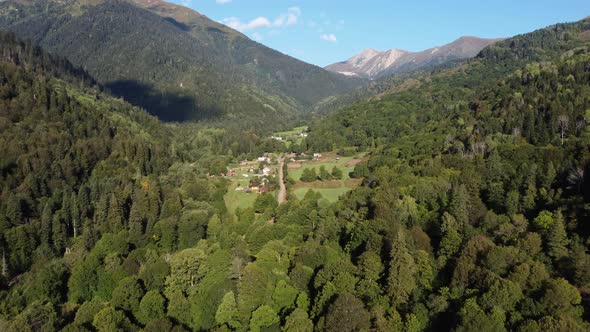 Small Village in Wilderness Between Mountains