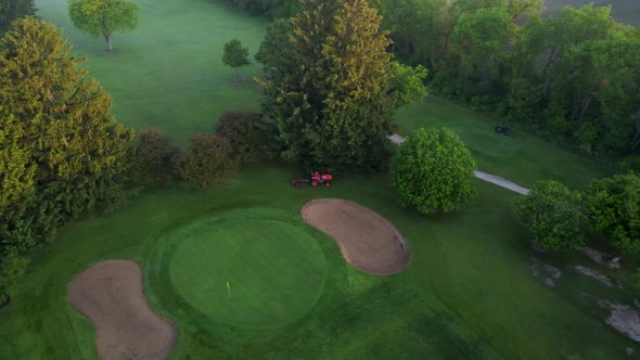 Drone Footage Of Preparing Golf Course For Playing In Early Morning Sunrise