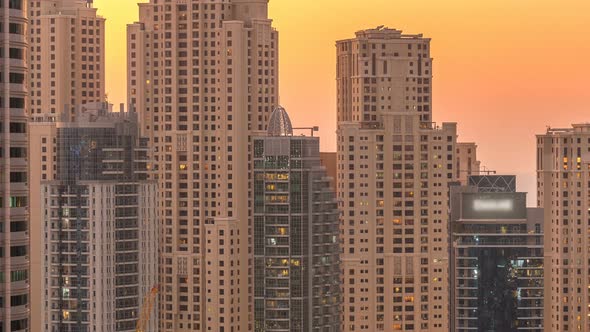 Dubai Marina and JBR Twers Panorama Day to Night Timelapse Lights Turn on