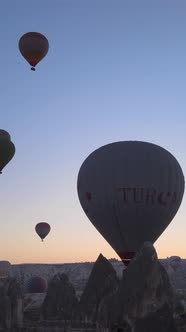 Vertical Video of Hot Air Balloons Flying in the Sky Over Cappadocia Turkey