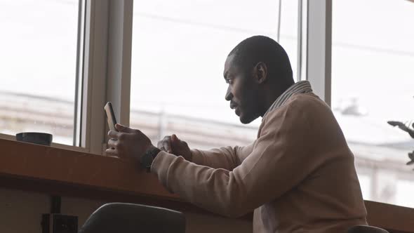 African-American Businessman Video Chatting on Smartphone