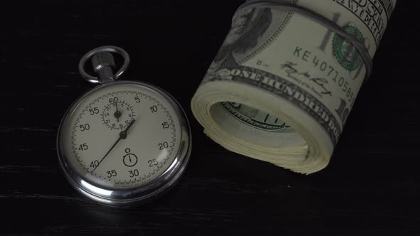 Dollars and stopwatch. Business concept of lost time and failed investments