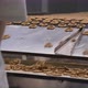 Snacks production Closeup conveyor, worker inspecting baked pretzel snacks - VideoHive Item for Sale