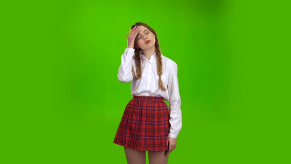 Girl Is Suffering From a Headache . Green Screen