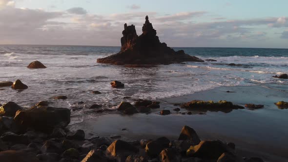 Aerial View of an Isolated Rock in the Ocean. Black Volcanic Sand Beach, Atlantic Ocean. Benijo