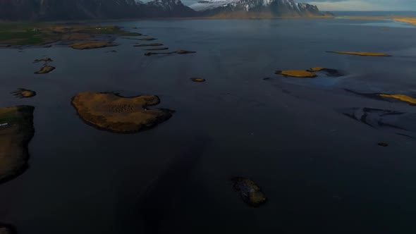 Fantastic Aerial Views of the Landscape in Iceland with Vestrahorn Mountains on the Horizon