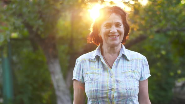 Smiling Mature Woman on Sunset