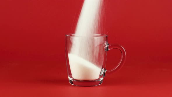 Pour Sugar Mug Glass Shot Thick Bottom Red Contrasting Background. Concept