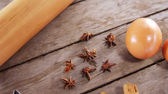 Various ingredients and brown egg on wooden table 4k