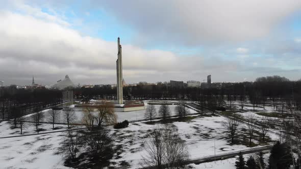 Aerial view of Victory Park and Memorial to Soviet Army on snowy winter day in Riga, Latvia