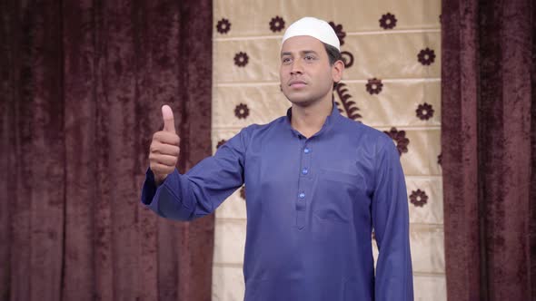 Muslim man showing Thumbs up