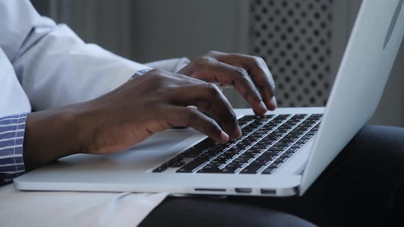 Male African American User Hands Typing on Laptop Keyboard Sit at Table Mixed Race Ethnic Student