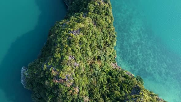 Aerial drone shot over Ha Long Bay, blue sea and limestone islands of Lan ha bay. Vietnam