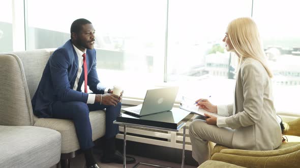 Business Meeting of Mixed Race Man and Woman